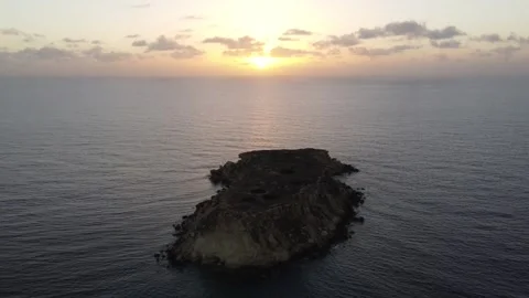 Island With Sunrise/Sunset Behind Video stock 255706953