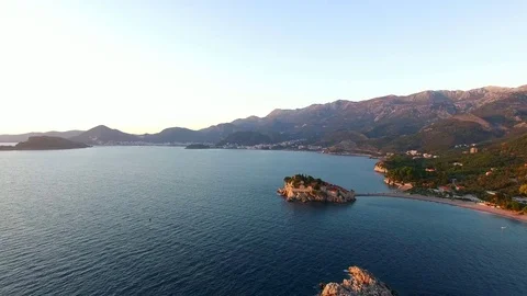 Island of Sveti Stefan, view from the beach of Crvena Glavica at Stock Footage