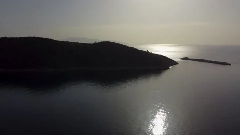 Island view against the sun Stock Footage 195029428