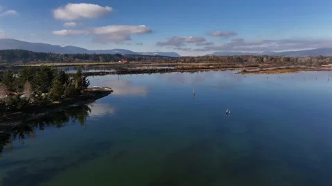 Islands, cloud reflections and shallow ocean floor - 4K Video stock 227259949