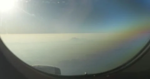 Islands emerging from the clouds from a plane Stock Footage 303749457