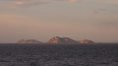 Islands on the horizon at sunset Stock Footage 312517559