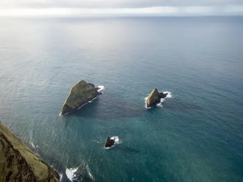 Islands in the ocean Stock Photos