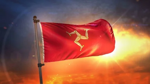 Isle of Man Flag Backlit At Beautiful Sunrise Loop Slow Motion 4K Stock Footage 76514442