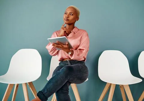 Isnt there an app for interview preps. Studio shot of an attractive young Stock Photos