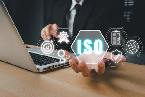 ISO standards quality control concept, Person hand holding iso icon on virt.. Stock Photos