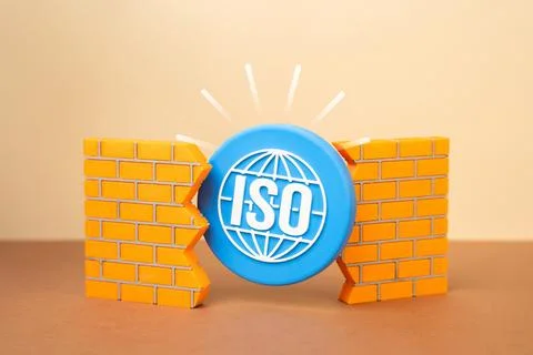 An ISO symbol breaking through a wall. Implementation of new rules and stan.. Stock Photos