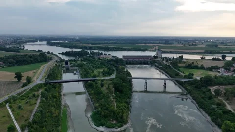 Isola Serafini hydroelectric complex and diversion channels reveal low Po River Stock Footage 340604020