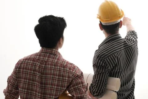 Isolaated back view two engineer discussing project Stock Photos