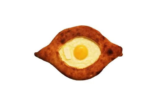 Isolate Adjarian khachapuri with egg. Top view Stock Photos