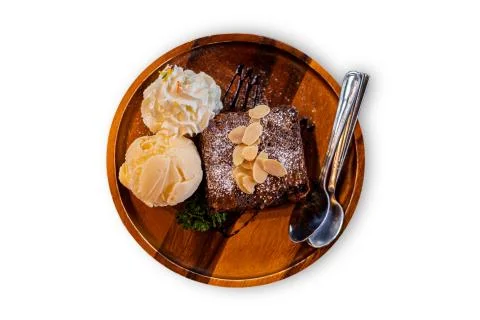 Isolate and cliping path Brownies icecream on wood plate. Stock Photos