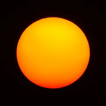 Isolate big red sun with black background Stock Photos