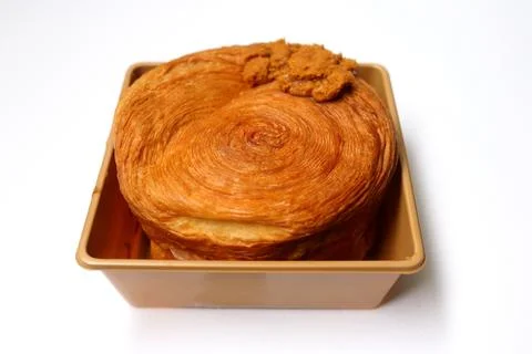 Isolate croissant roll in plastic box. Stock Photos