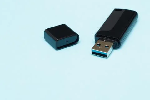 Isolate flash drive on a blue background. electronics concept. memory for tra Stock Photos