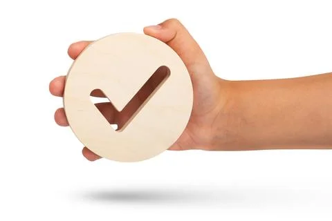 Isolate of hand holding check mark icon on white background. Closeup hand with Stock Photos