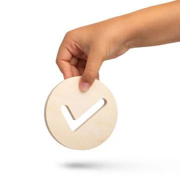 Isolate of hand holding check mark icon on white background. Closeup hand with Stock Photos