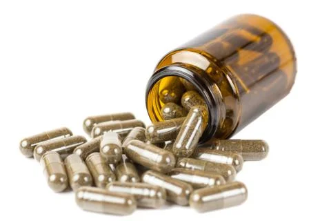 Isolate pills or tablets  in the glass brown bottle on a white background Stock Photos