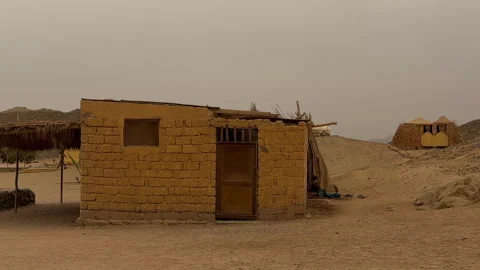 Isolated Adobe Structure With Simple Roof And Open Entrance Amidst Gentle Stock Footage 337939830