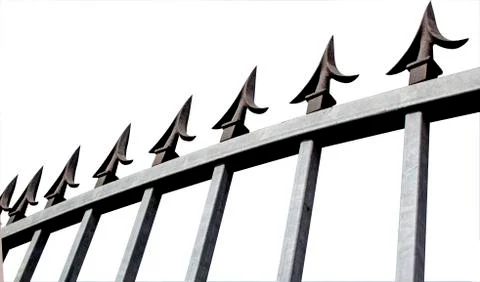 Isolated angle view of galvanised security gate and decorative spikes Stock Photos