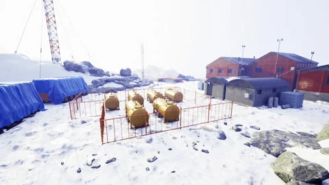 Isolated arctic storage facility with orange buildings and icy terrain Stock Footage 340664981