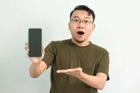 Isolated Asian Guy Using Smartphone Stock Photos