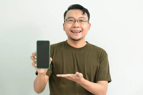 Isolated Asian Guy Using Smartphone Stock Photos