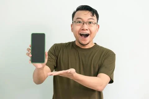 Isolated Asian Guy Using Smartphone Stock Photos