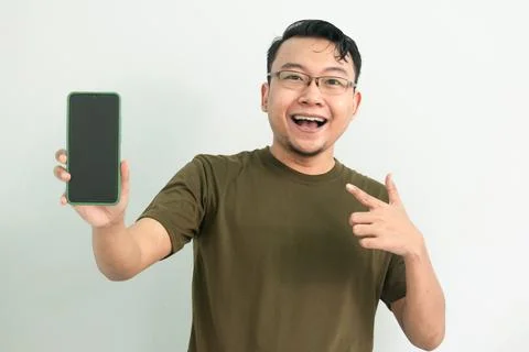 Isolated Asian Guy Using Smartphone Stock Photos