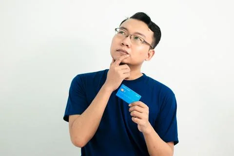 Isolated Asian Man Hold Credit Card in Blue Concept Stock Photos