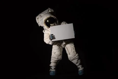 Isolated Astronaut hold a white sheet Stock Photos