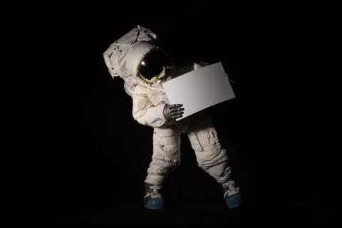 Isolated Astronaut hold a white sheet Stock Photos