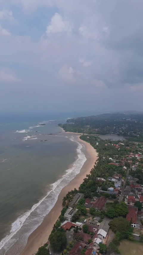 An Isolated beach, waves gently crashing onto the shore Stock Footage 314112843