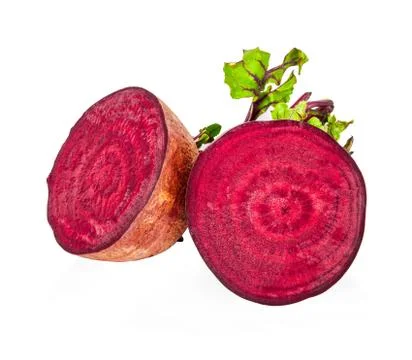 Isolated beetroot. One fresh red beet with leaves and a half isolated on whit Stock Photos