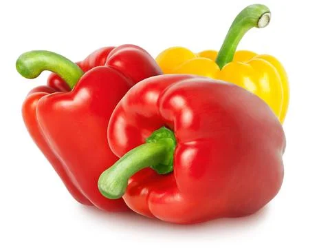 Isolated bell peppers. Two red and yellow bell pepper isolated on white Stock Photos