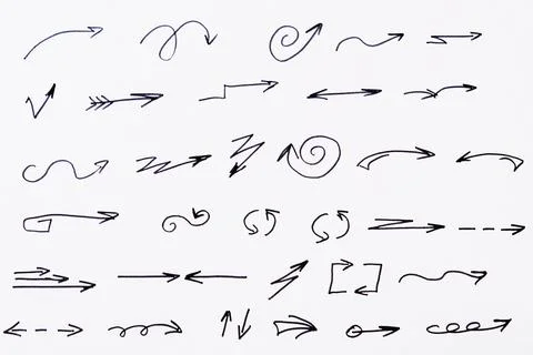 Isolated black arrows drawn by hand on a white background.. Stock Illustration
