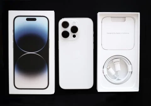 Isolated on black background new IPhone 14 pro in silver color with a triple Stock Photos