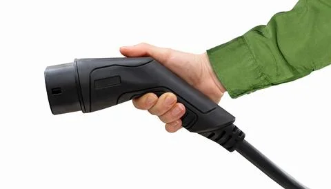 Isolated black EV charging plug in female hand. Electric car charging connect Stock Photos
