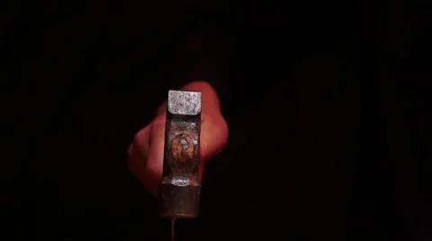 Isolated on black hand with hammer slow motion dolly shot Stock Footage 58530365