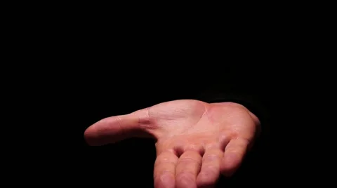 Isolated on black hand showing hocus pocus with subject appearance Stock Footage 58577255