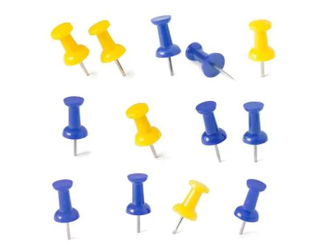 Isolated blue and yellow push pins in white background Stock-Fotos