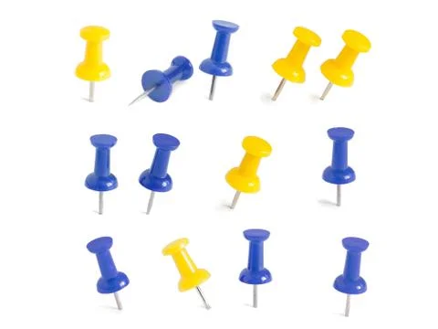 Isolated blue and yellow push pins in white background Stock Photos