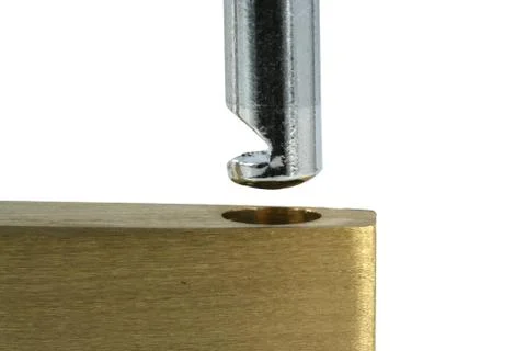 Isolated brass open lock on white macro Stock Photos