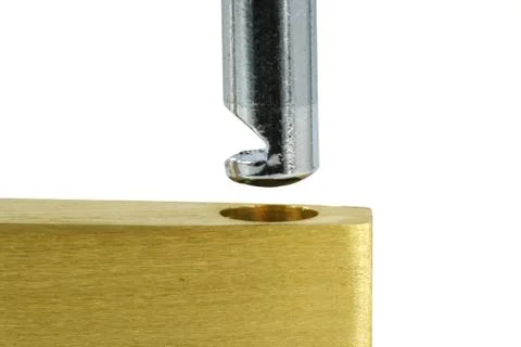 Isolated brass open lock on white macro Stock Photos