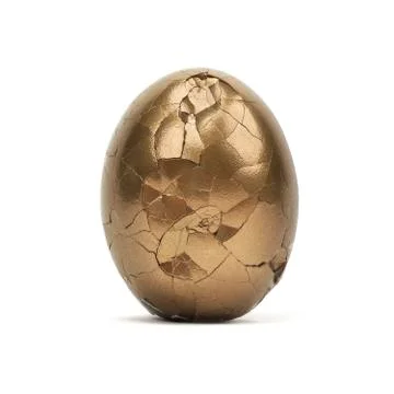 Isolated Broken Gold Egg Stock Photos