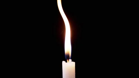 Isolated Burning Candle with Bright Flame on Dark Background with Falling Snow Stock Footage 312013295