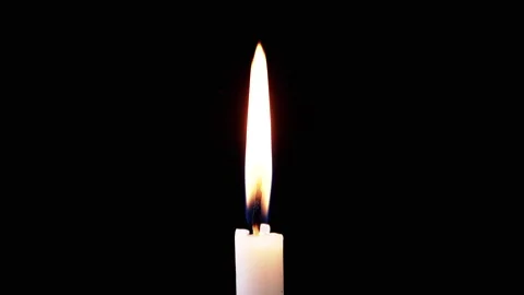 Isolated Burning Candle with Bright Flame on Dark Background with Falling Snow Stock Footage 312013571