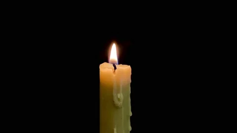 Isolated candle burning with dark background Stock Footage