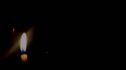 Isolated candle burning with dark background. Stock Footage 176467215