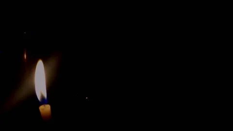 Isolated candle burning with dark background. Stock Footage 176467220