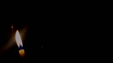Isolated candle burning with dark background. Stock Footage 176467222